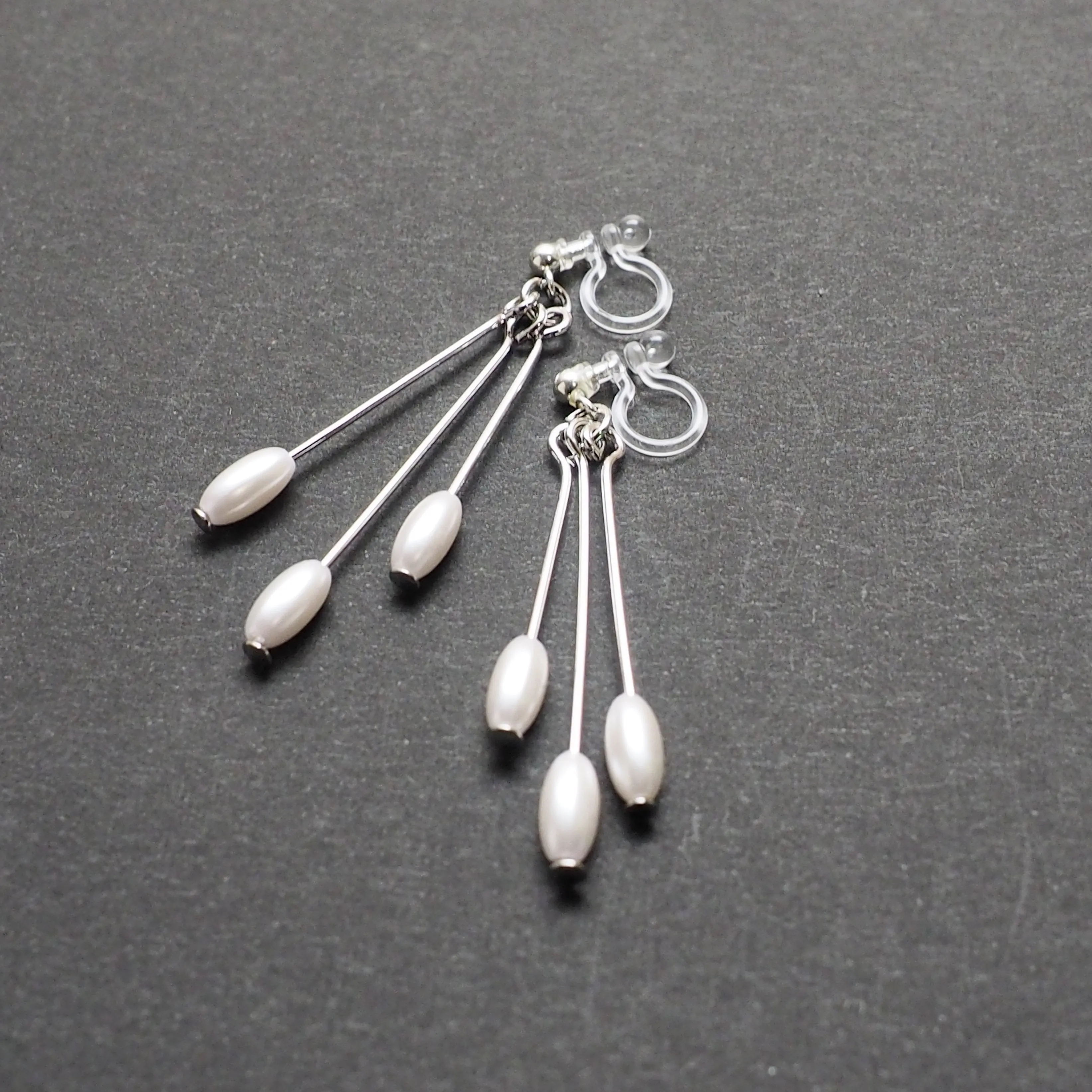 Dangle white pearls & silver sticks invisible clip on earrings