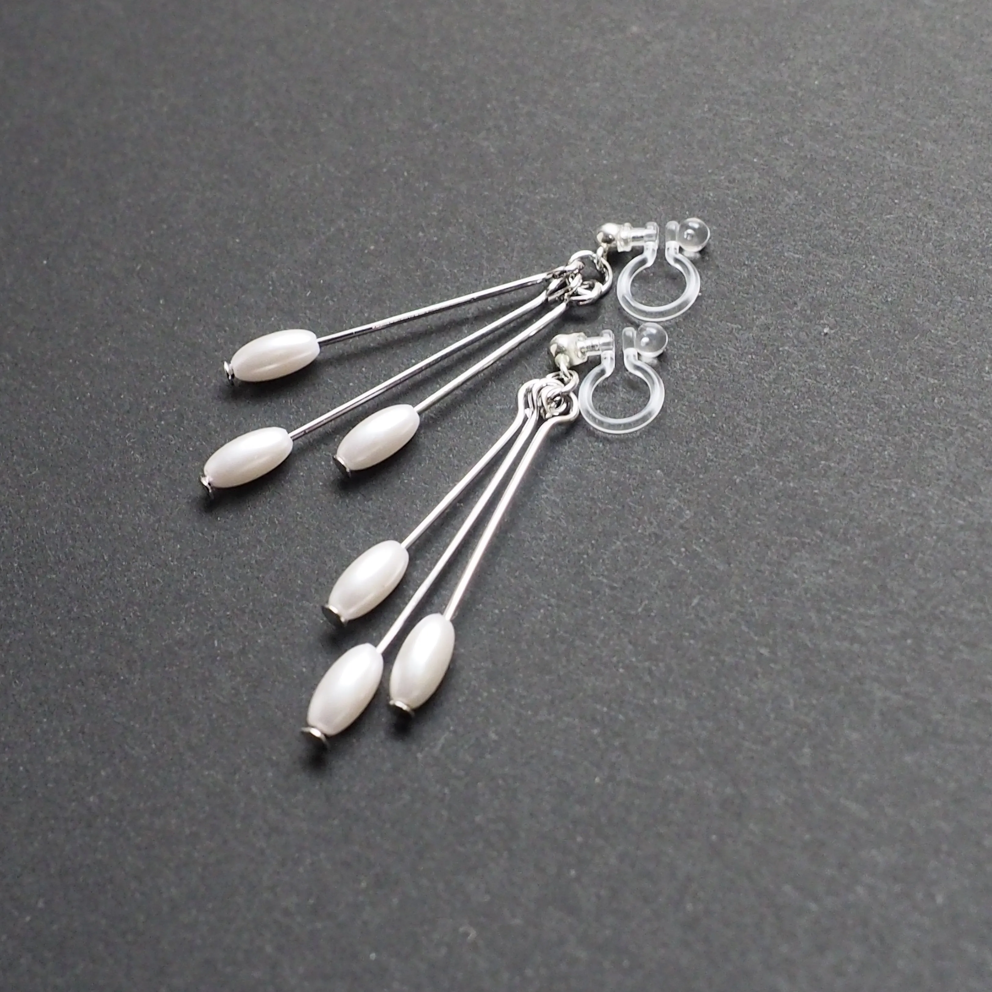 Dangle white pearls & silver sticks invisible clip on earrings